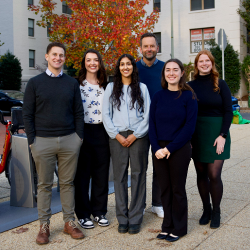 Six people standing and smiling for the camera