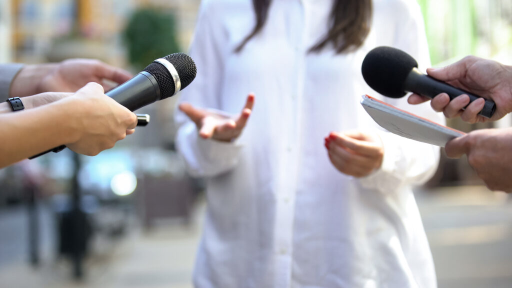 A politician talking at a press conference.